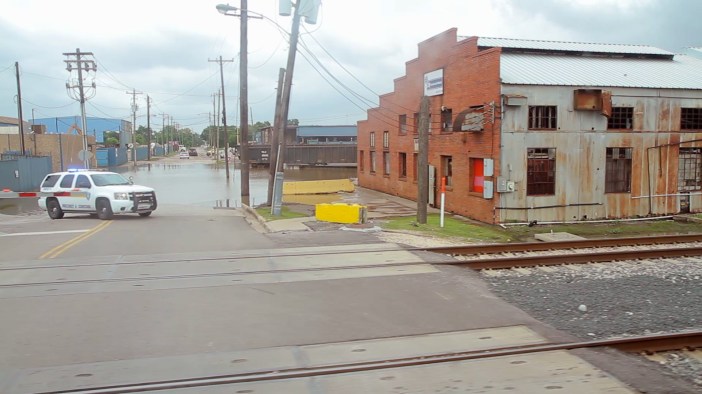 A police car blocks off a flooded street in Houston, Texas.